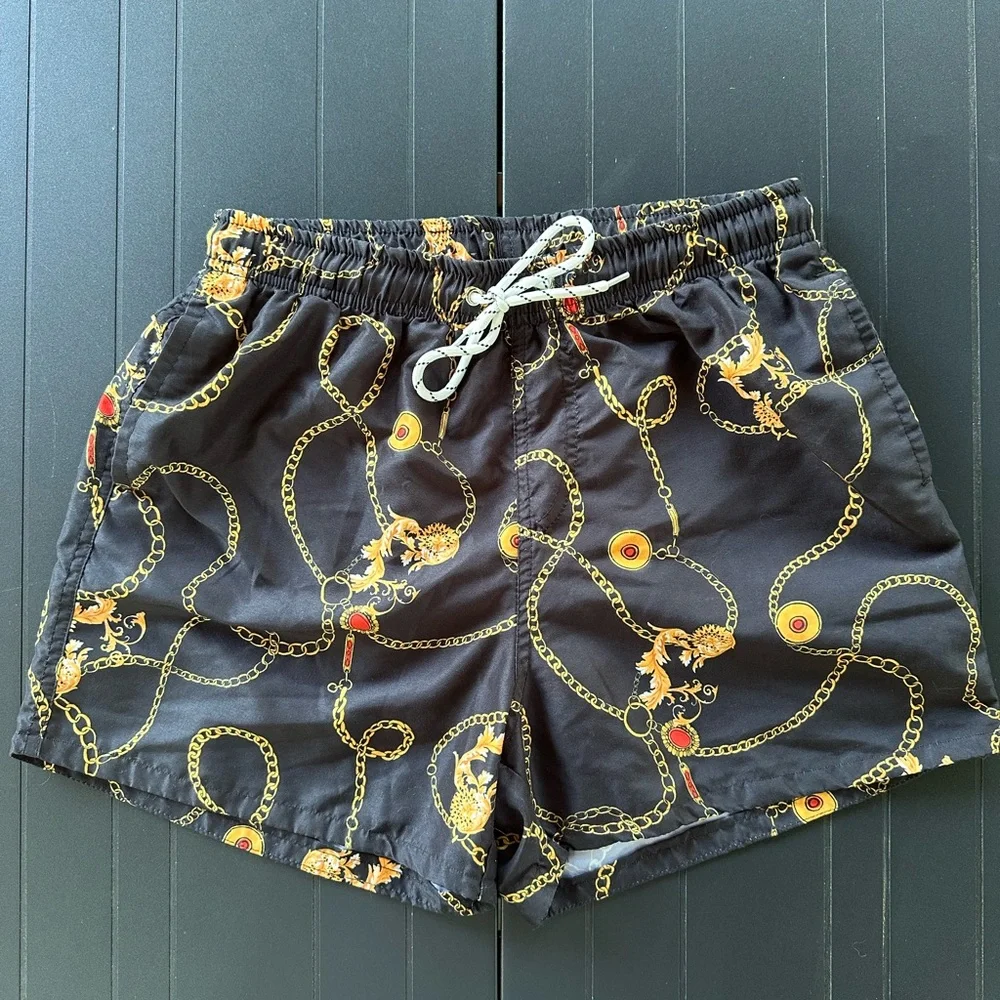 Black Men’s Swim Trunks with Gold Chain and Red Accents